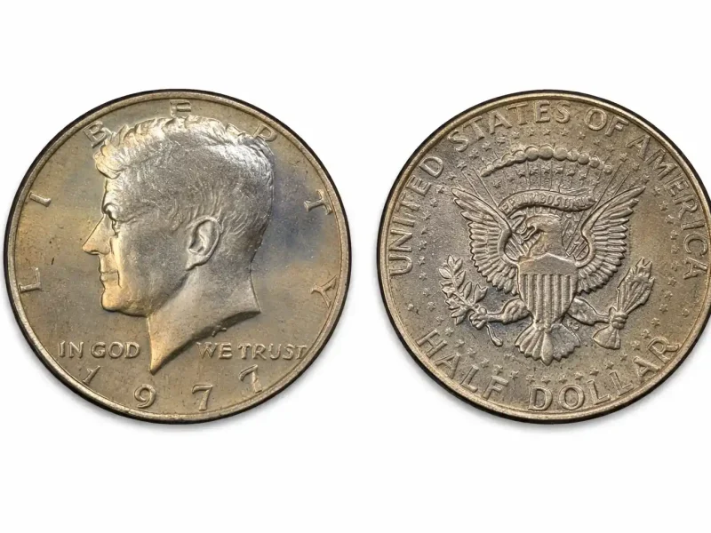 Obverse and reverse of a 1977 Kennedy half dollar on a white background.